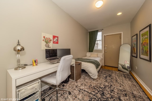 bedroom featuring recessed lighting, vaulted ceiling, baseboards, and wood finished floors