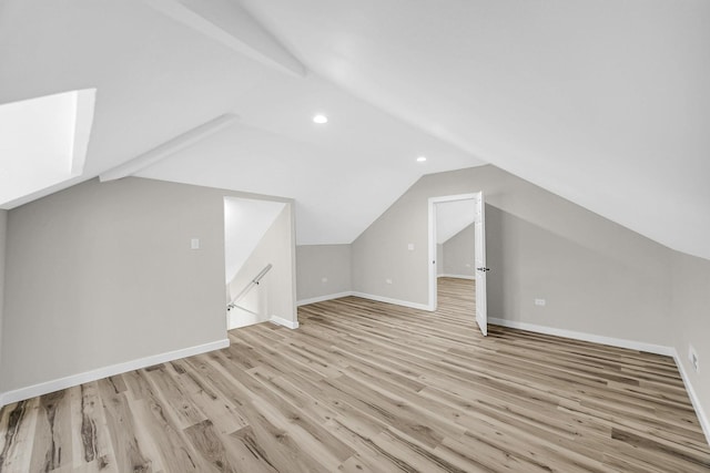 bonus room featuring lofted ceiling, light wood-style floors, baseboards, and recessed lighting