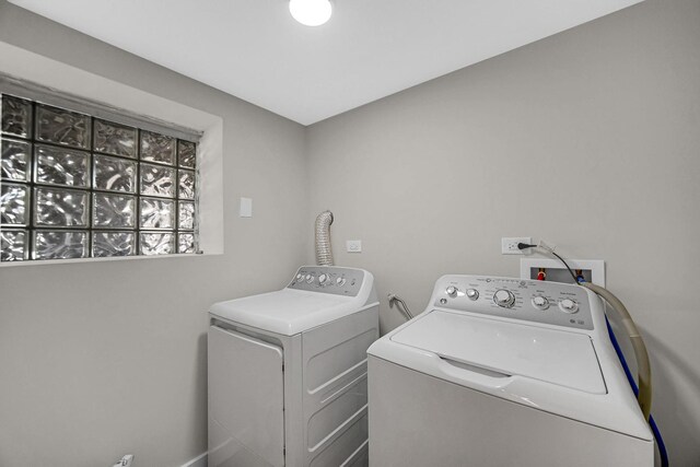 washroom with laundry area and washing machine and clothes dryer