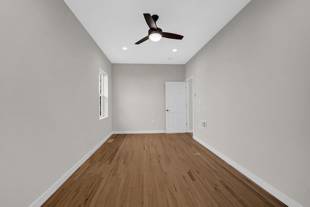 empty room featuring recessed lighting, visible vents, a ceiling fan, wood finished floors, and baseboards