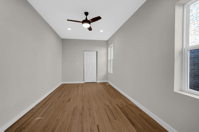 unfurnished bedroom with ceiling fan, baseboards, wood finished floors, and recessed lighting