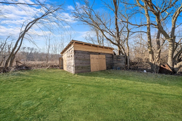 view of yard with a storage unit and an outbuilding