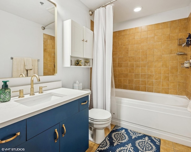 full bath with tile patterned flooring, vanity, toilet, and shower / bath combo with shower curtain