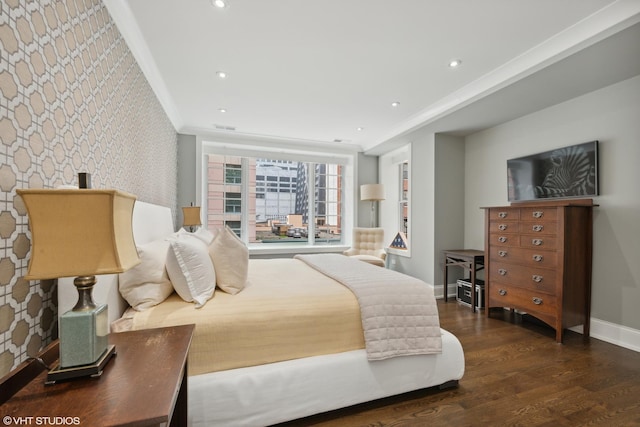 bedroom with recessed lighting, an accent wall, dark wood-type flooring, baseboards, and wallpapered walls