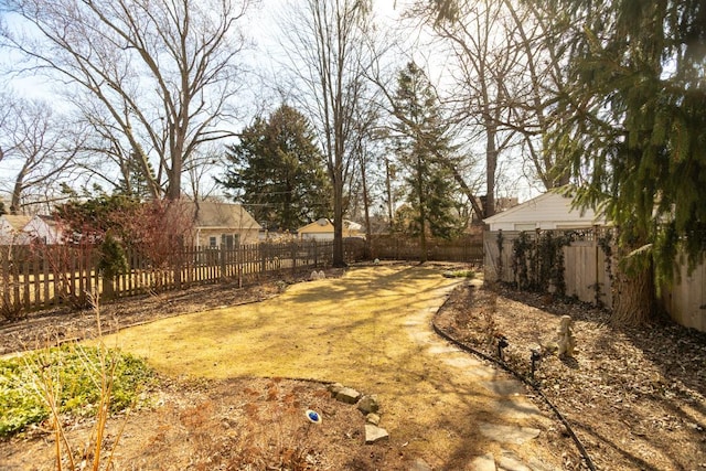 view of yard with a fenced backyard