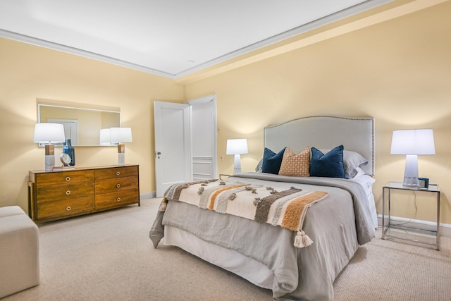 bedroom featuring baseboards, ornamental molding, and light colored carpet