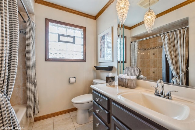 bathroom featuring tile patterned flooring, toilet, vanity, baseboards, and crown molding