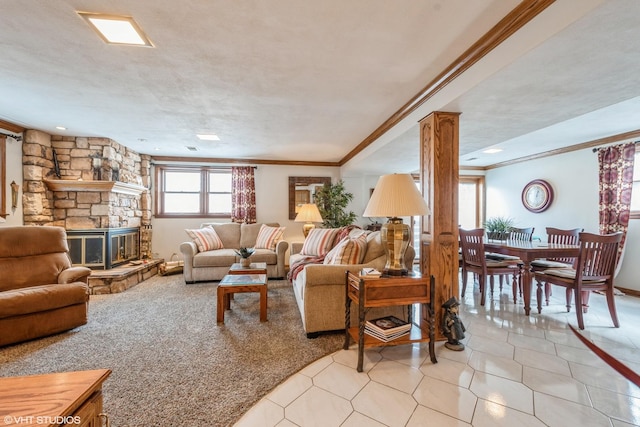 living area featuring light carpet, light tile patterned flooring, crown molding, and a stone fireplace