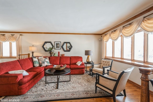 living room with baseboards, ornamental molding, and wood finished floors