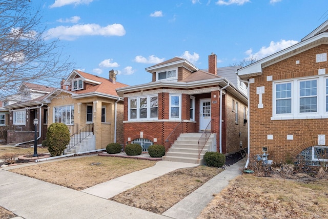 bungalow-style home with brick siding and a chimney