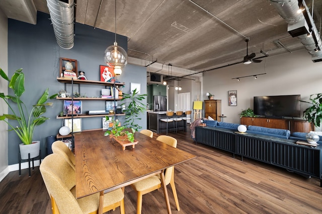 dining area featuring ceiling fan and wood finished floors