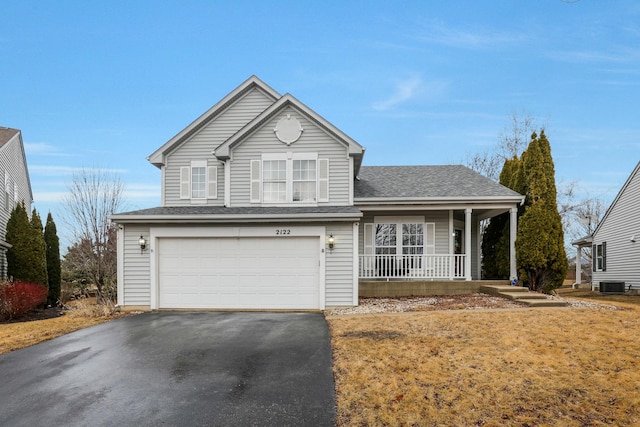 traditional home featuring central AC unit, an attached garage, covered porch, a shingled roof, and driveway