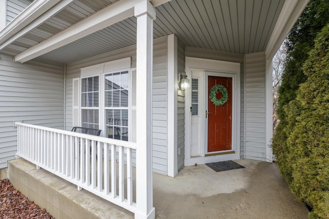 view of exterior entry with covered porch