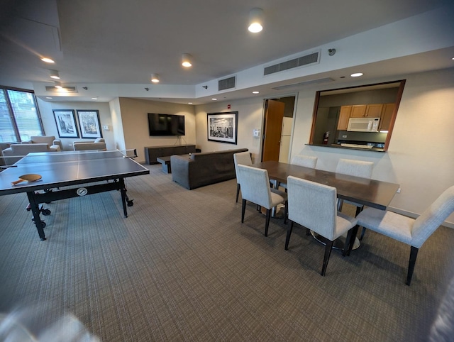 recreation room featuring recessed lighting, visible vents, and carpet flooring