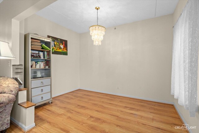 420 W Burlington Ave Unit 303, La Grange, IL 60525 - sitting room featuring light wood-type flooring and a chandelier