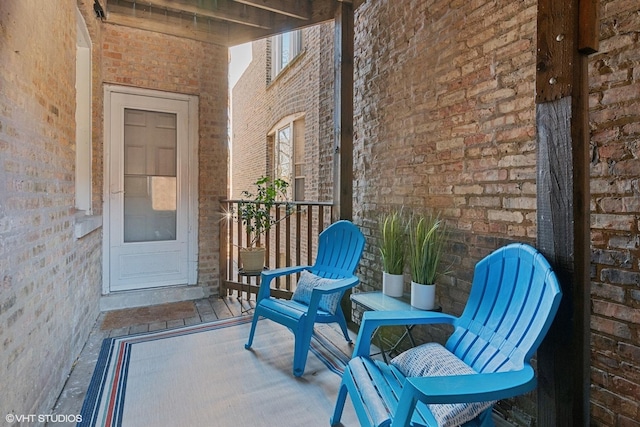 property entrance featuring brick siding