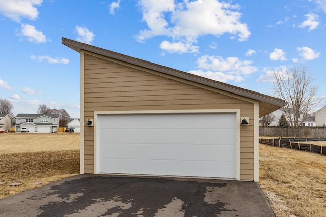 detached garage with fence