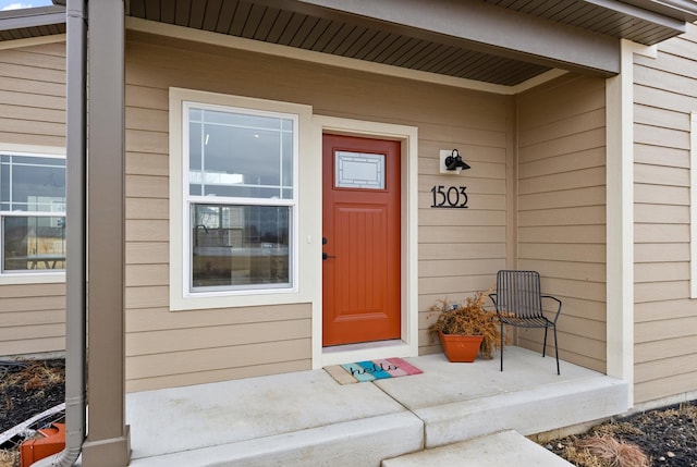 doorway to property featuring a porch