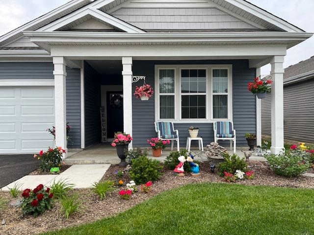 view of front of home with a garage and a porch