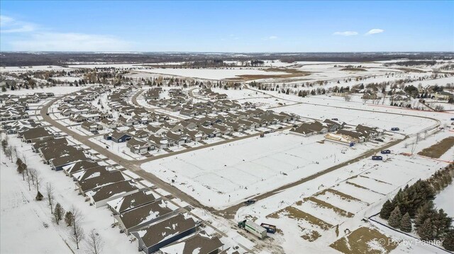 snowy aerial view featuring a residential view