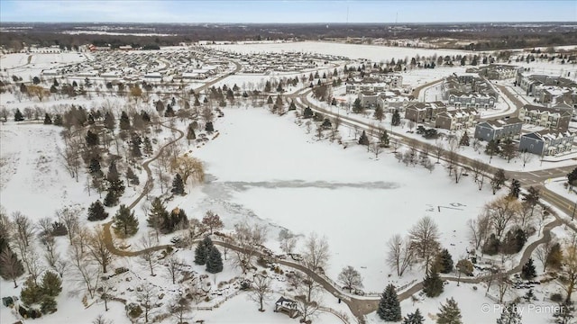 snowy aerial view with a residential view