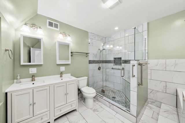 bathroom featuring marble finish floor, a sink, visible vents, and a shower stall