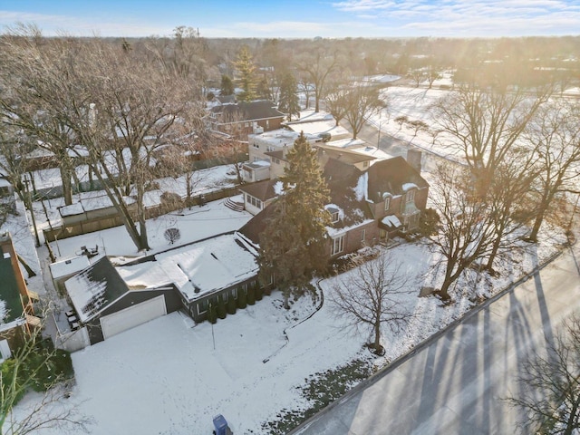 snowy aerial view with a residential view