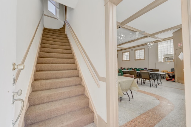 stairway with coffered ceiling