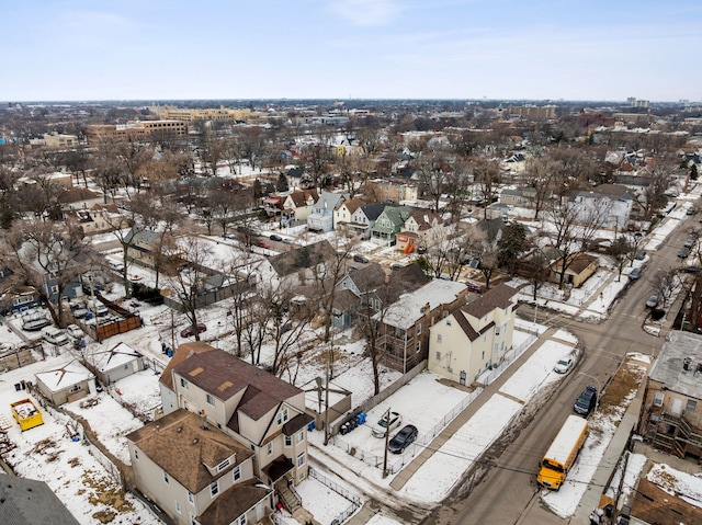 snowy aerial view with a residential view