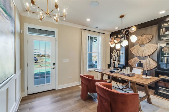 interior space featuring recessed lighting, baseboards, and wood finished floors