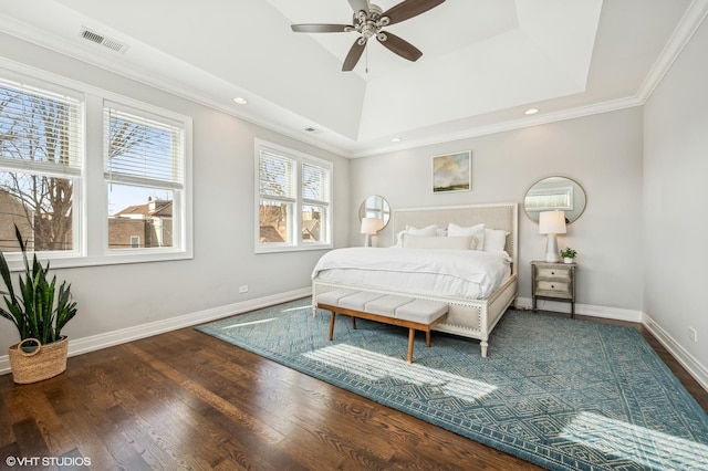 bedroom featuring recessed lighting, wood finished floors, visible vents, baseboards, and crown molding