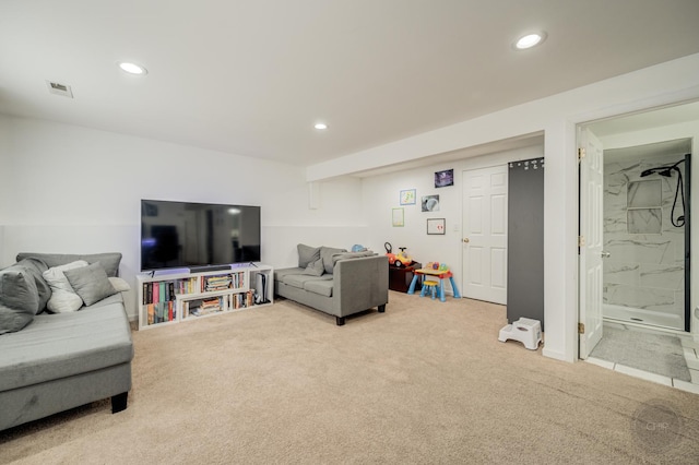 living area featuring visible vents, carpet flooring, and recessed lighting