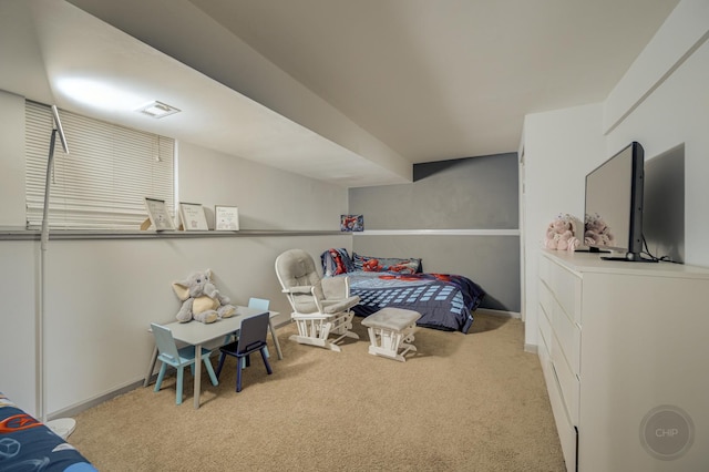 bedroom featuring carpet floors, visible vents, and baseboards