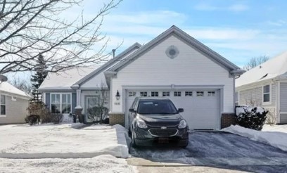 view of front of property featuring driveway and an attached garage