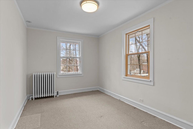 unfurnished room featuring carpet, baseboards, plenty of natural light, and radiator heating unit