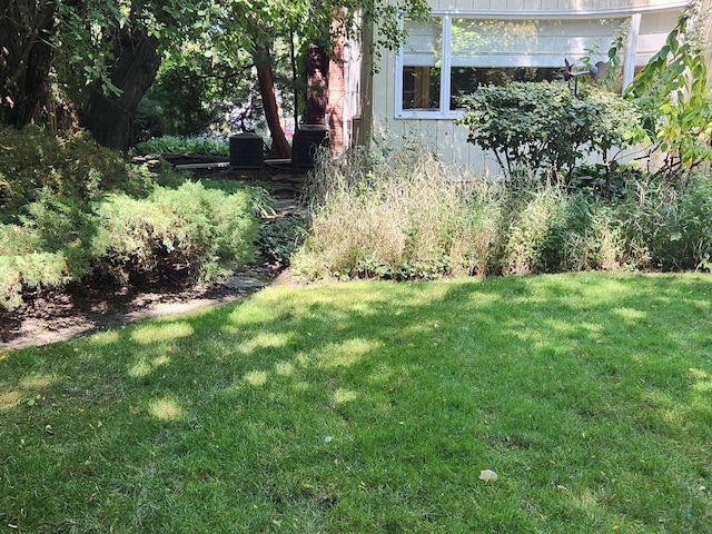 view of yard featuring central AC