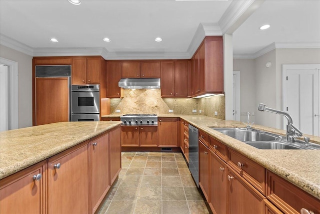 kitchen with under cabinet range hood, stainless steel appliances, a sink, tasteful backsplash, and crown molding