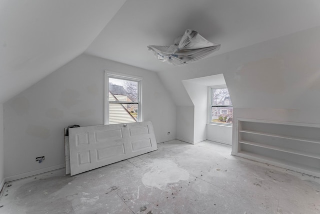 bonus room featuring lofted ceiling