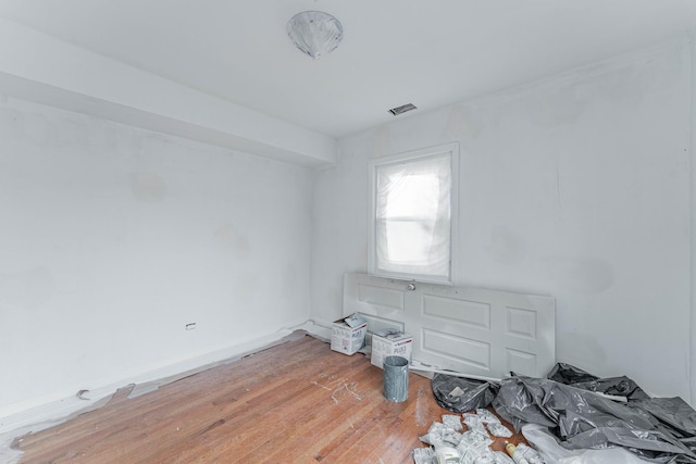 empty room featuring wood finished floors