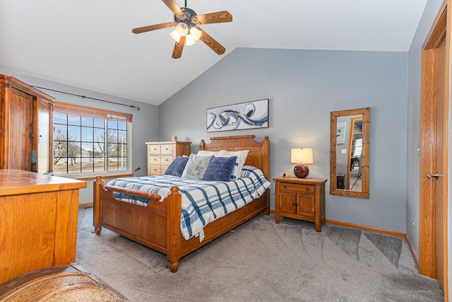 bedroom with light colored carpet, vaulted ceiling, baseboards, and ceiling fan