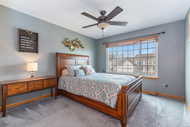 bedroom with carpet floors, baseboards, and a ceiling fan