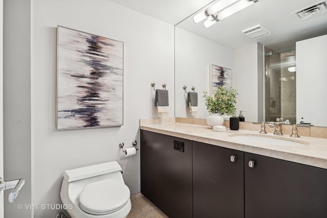 full bath featuring toilet, a stall shower, visible vents, and vanity