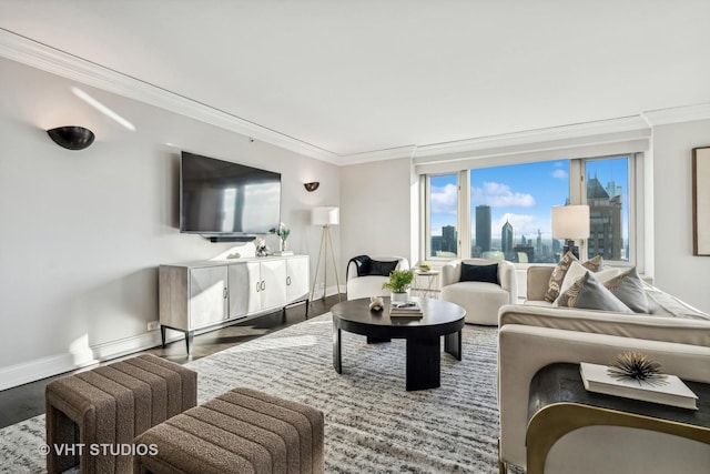 living area featuring ornamental molding, wood finished floors, and baseboards