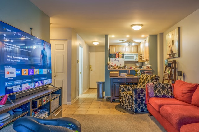 living area featuring baseboards and light tile patterned flooring