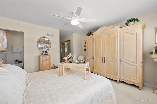 bedroom featuring light carpet, baseboards, visible vents, and a ceiling fan