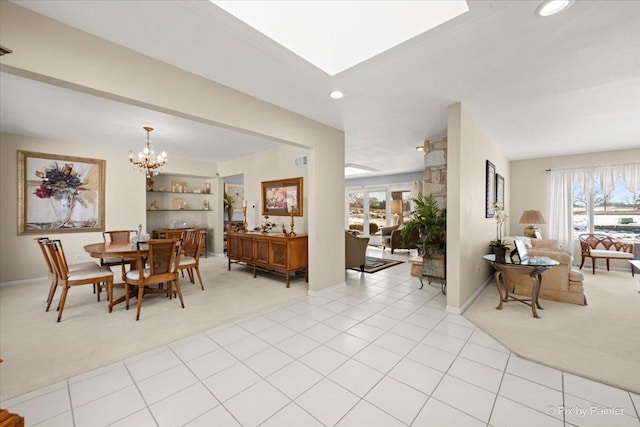 dining room with an inviting chandelier, recessed lighting, light tile patterned flooring, and light colored carpet