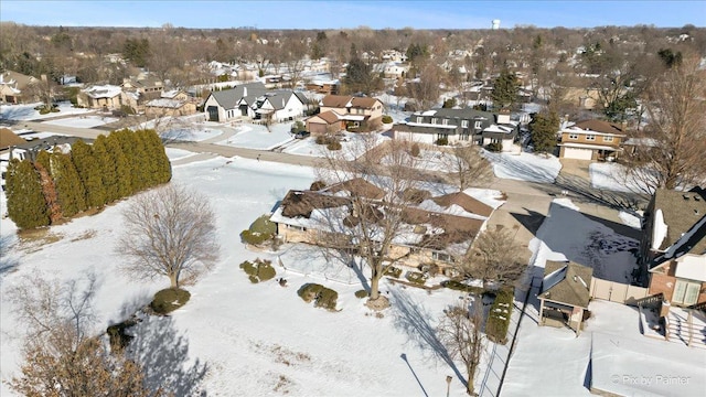 snowy aerial view with a residential view