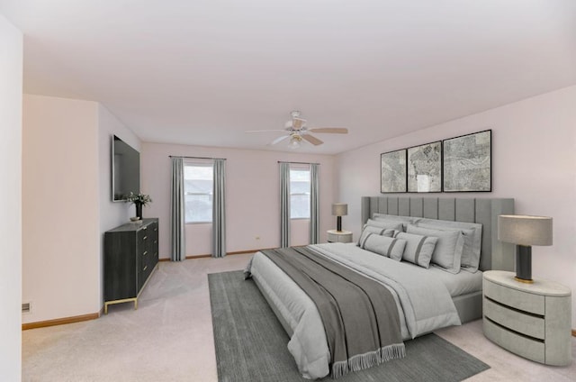 bedroom with light carpet, a ceiling fan, and baseboards