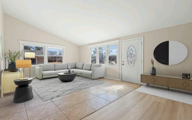 tiled living area with a wealth of natural light and lofted ceiling