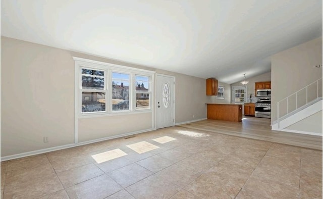 unfurnished living room featuring light tile patterned floors, stairs, baseboards, and vaulted ceiling